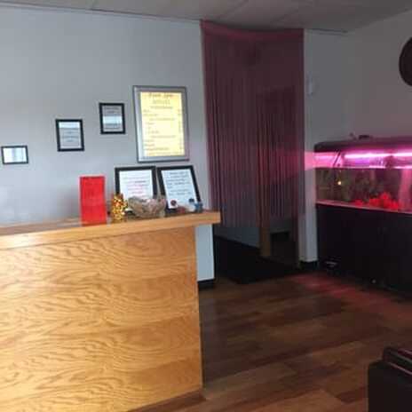 Picture of Foot Spa's front desk, entrance to hallway and our favorite, our fish tank. Come see our little sweethearts.
