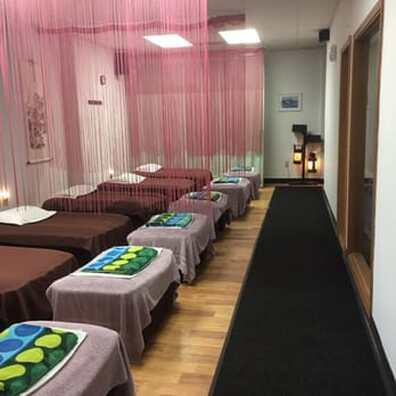 Picture of foot massage room. See the many reclining couches